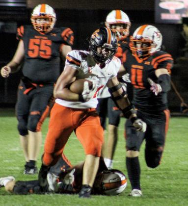 A swarm of Wautoma Hornets, Skyler Royston, Carson Armstrong, and Peter Idsvoog, were unsuccessful in their attempt to stop Richland Center Hornet Tight End, Teige Perkins, before he got to the end zone and secured a touchdown.