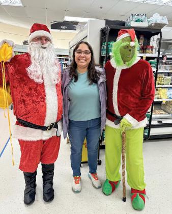 Belinda Peterman recieved a visit from Santa and the Grinch at Pick-n-Save in Wautoma.