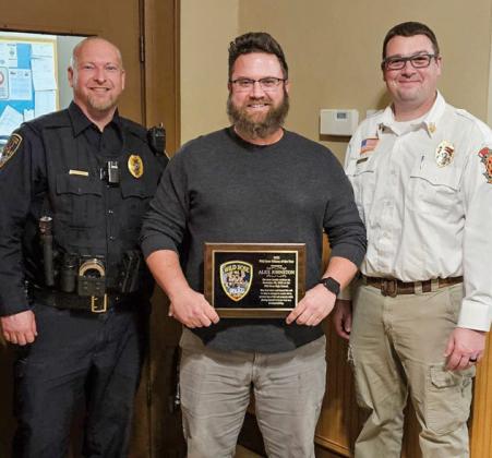 For Alex Johnston’s heroic efforts he was awarded the Wild Rose Police Department 2023 Citizen of the Year Award at the Jan. 3 Wild Rose Village Board Meeting. Presenting the award to Alex Johnston is Wild Rose Fire District Chief Allen Luchini and Wild Rose Police Dept. Chief Nate Klapoetke.