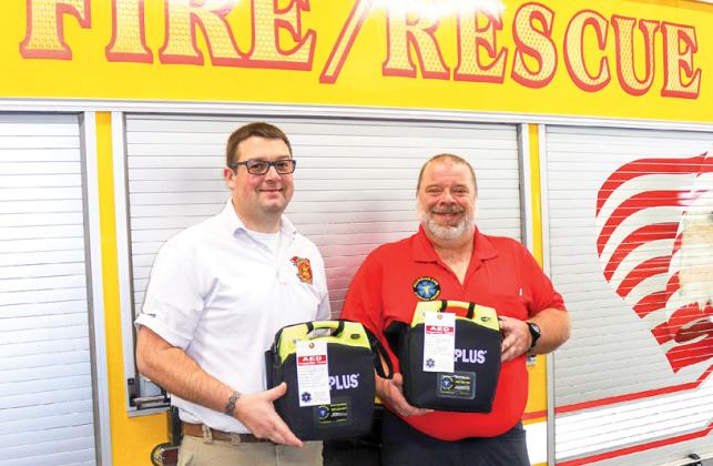 Pictured are Fire Chief Allen Luchini of the Wild Rose Area Fire District and Pete Fischbach, owner of Guardian CPR.