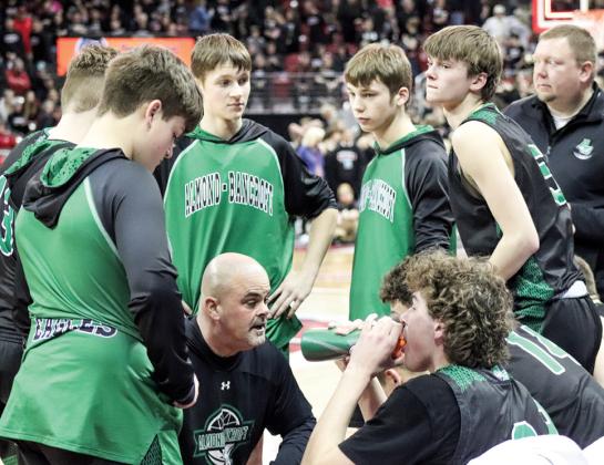 Head Coach Curt Lamb talks with the team before the start of the second half of the State Semi-Final.