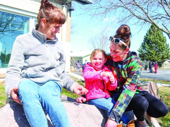 Shari Cavette, Jordan Chmiel, and Jacqui Lochinger count the eggs they found during the Redgranite Easter Egg Hunt on March 23 at the Redgranite Elementary School. 