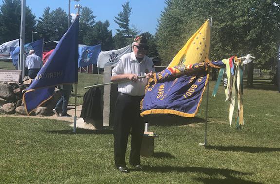 John Zouski, a member of both posts, was seen folding the flag after the ceremony.