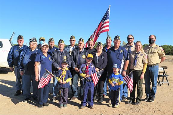 Members of the Wautoma American Legion Post 317, the Wild Rose American Legion Post 370, and the Wautoma-Wild Rose-Redgranite Cub Scout Pack 3650 that attended the annual Flag-Burning ceremony at Kelley Sand & Gravel’s gravel pit on Saturday, September 10 gathered for a group picture following the ceremony:  (back) Rod Holtz, Richard Garbe, Tom Raymond, Jack Greenwood, Tim Bohn, Warren Kuester, Steve Jalensky and Charles Fischbach, Cub Scout leaders, (center) Ken Bruch, Wild Rose American Legion Post 370 Co