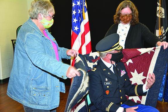 Presenting the Quilt of Valor to Chaplain Alan Spitler was Cindy Malnory and Lisa Schilling.