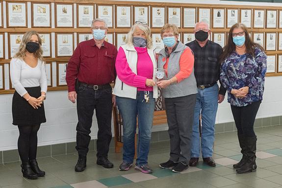 Chelsie Bohler, with members of the Coloma Area Historical Society who received the 2020 Non-Profit of the Year award, Dennis Apps, Sue Apps, Barb Burrows, Ray Burrows, and Julie Lesch.