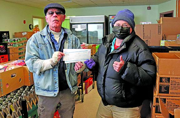 Food Pantry accepts check from Charter Spectrum Communications