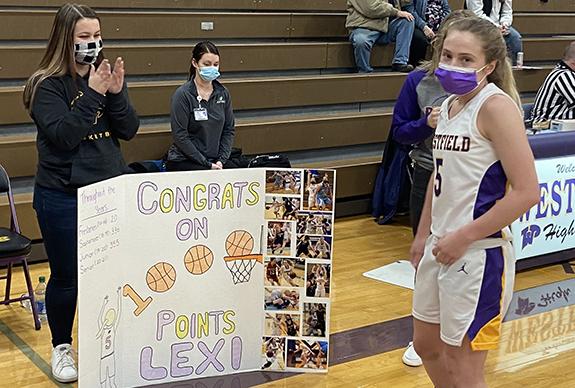 Lexi Brakebush scored her 1000th point as a Lady Pioneer during the Tuesday night game against Mauston.