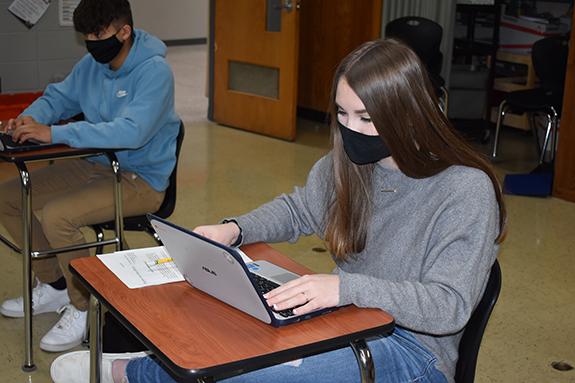Megan Kelly, a Wautoma High School junior, works on her Chromebook to translate a document for the Wautoma Public Library during her Translation and Interpretation Class.