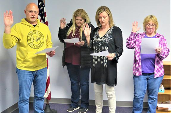 Redgranite Village Clerk Christy Groskreutz administered the oath of office to the April 6 spring election newly-elected/re-elected board members at the Apr. 20 Redgranite Village Board meeting: Fred Eichmann, Sandy Lyles, Belinda Passarelli, village president, and Laurie Oltesvig. 