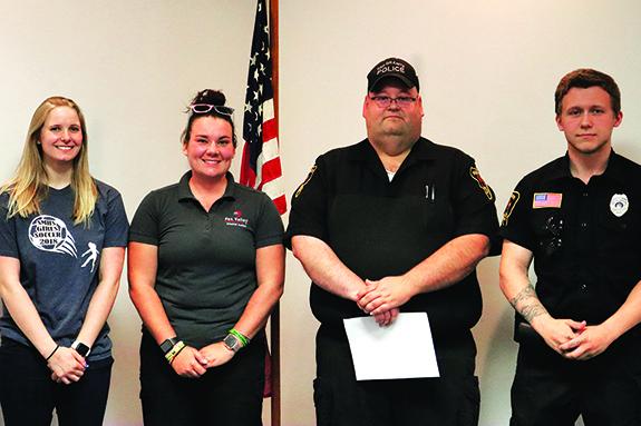 Three new officers took an oath during the June 15 meeting of the Redgranite Village Board. Pictured are Ali Sowieja, Part-Time Police Officer, Brieanne Chappa, Part-Time Police Auxiliary/CSO Position, Kyle Tarr, Police Chief, and Carter Lawson, Full-Time Police Officer.