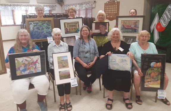 The Wisconsin Regional Art Program (WRAP) show was held on June 5 at the Wautoma Senior Center. State winners will advance to the competition in Madison. State winners were (top): Mary Crnovich, Kathy Sletten, Sue Delain, and Brenda Mulvey; (bottom): Betsy Borchardt, Rachel Pavlic, Judge Leslee Nelson, Pat Spear, and Kathy Teichmiller .