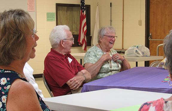 Clyde and Marilyn Holmes of Wautoma participate in a trivia activity at Memory Café on August 30th.
