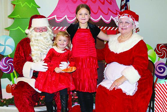 Kendra, 8, and Kizlee O’Kon, 3, visited Santa Claus and Mrs. Claus on Dec. 4 at the Redgranite Lions Hall. Santa and Mrs. Claus helped keep the Christmas spirit alive during the Hometown Holiday celebration on Dec. 4.