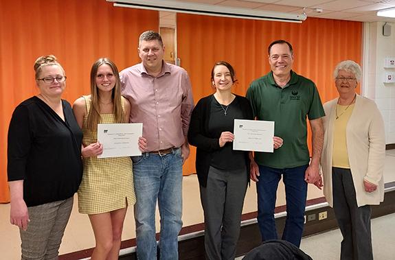 Two scholarships were awarded to Waushara County students from the Waushara County HCE. Pictured are Juleanna Johnson with her parents, Jessica Maurer & Matthew Johnson and Lynn & Eric Momsen, accepting the scholarship for their son, Andrew, along with Pat Johnson, Scholarship Chair, presenting the awards.
