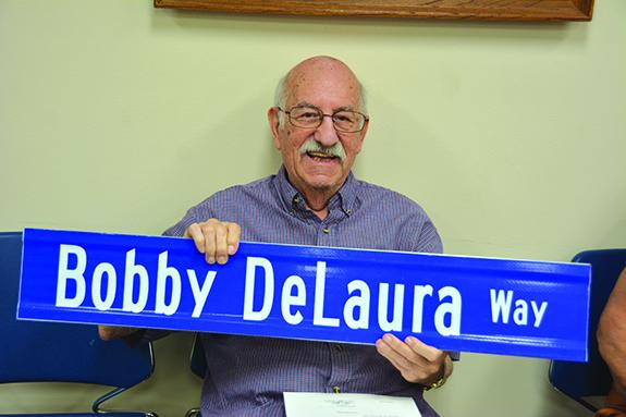 Bobby DeLaura was all smiles at the Wautoma City Council meeting on June 20 when he was surprised with a street renamed “Bobby DeLaura Way”.