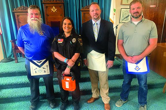 On July 11 the Wautoma Masonic Lodge presented Officer Chappa of the Redgranite Police Department an FST (Fire Suppression Tool), identical to the one given to the Wautoma Fire Department this past year. Pictured are Bro. Adam J. Rigden, Officer Brie Chappa, Bro. Paul Mott, and Bro. Victor Magnus.