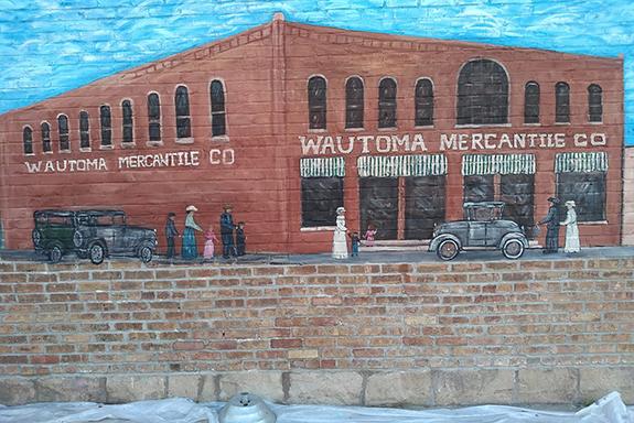The first of five depictions of Waushara County history has been completed on the wall of the Wautoma Mercantile Co. that houses the County Cupboard on Main Street in Wautoma.