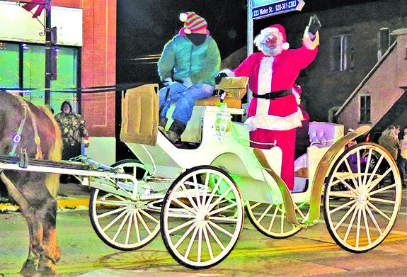 Santa Claus delighted children and adults alike when his carriage closed the 37th Annual Berlin Holiday Parade.