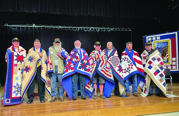 Golden Needle Quilt Guild awarded eight Quilts of Valor at the Almond Memorial Day Ceremony.  Veteran recipients included: Sherry Caves, Don Dickhut, Greg Durovy, Glenn Ehlers, Norman Groshek, Charles Oswald, Chris Studinski and Allen Worden.