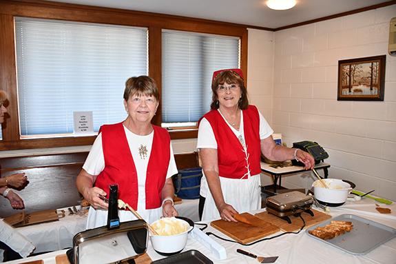 Linda Bergen and Char Stratton were kept busy making krumkake.