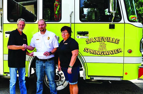 Oakwood Campsites presents donation to Saxeville Fire Department 