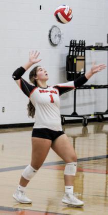 Hornet, Madalyn Meyer, sets up for a powerful serve during Sept. 19. game, where Wautoma High won 3-1 against Nekoosa Papermakers. 