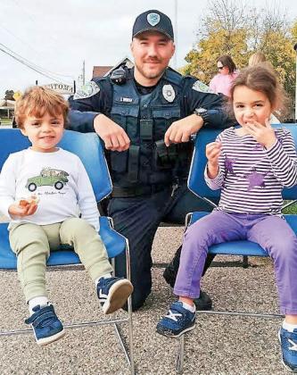 Kristof, 2, Adelina Mitchell, 3 and Officer in training Justin Wolff