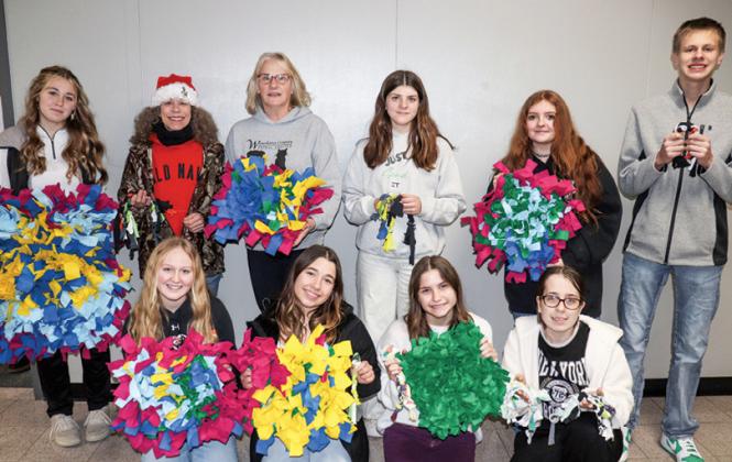 FCCLA members presented their homemade snuffle mats to the Waushara County Animal Shelter. (back): Shyann Royston, Julia Staehler, Waushara County Animal Shelter, Jane Pfaller, Waushara County Animal Shelter, Lily Friday, Zoey Generose, and Aidan Young; (front): Ava Inda, Bella Smith, Liesie Mager, and Lizette Riese.