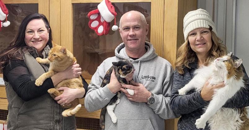 Pictured are Erin Flynn holding Pumpkin, Scott Steele holding Sweet Pickle and Karen Tschurwald holding Sprecher. Pumpkin and Sweet Pickle are currently available for adoption at WCAS.