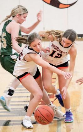 Autumn Stern and Aspen Groskreutz chase after the ball together to get it in the Lady Hornet’s possession.