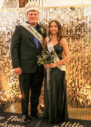 The 2023 Prom King Peter Idsvoog escorts 2023 Queen Lily Thomsen. 